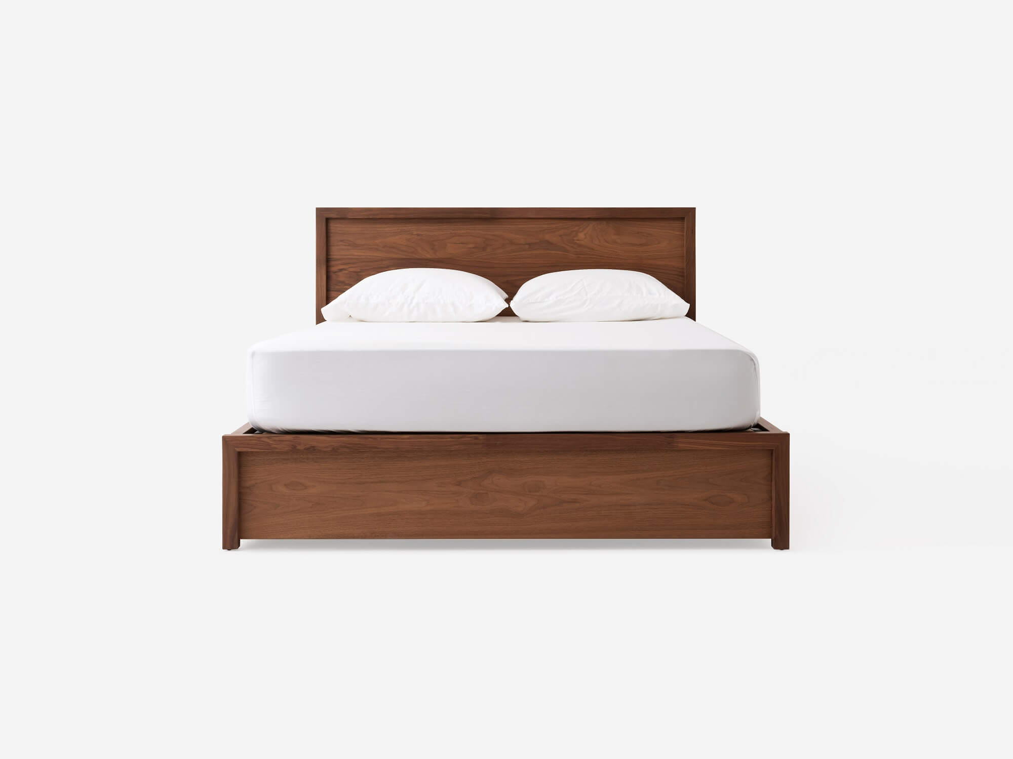 Front view of our modern walnut Marcel drawer storage bed